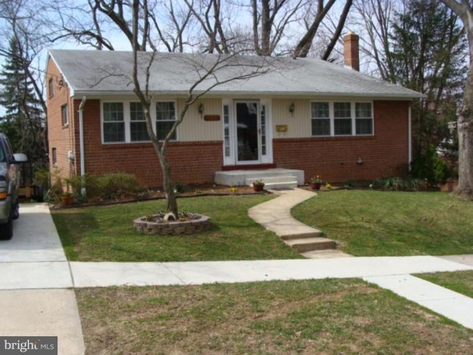 12818 Crisfield Road Silver Spring, MD 20906 - Photo 1 of 21 a front view of a house with a yard