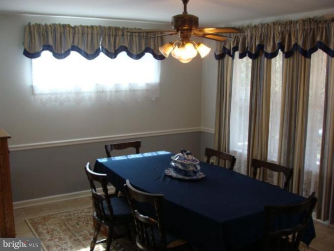12818 Crisfield Road Silver Spring, MD 20906 - Photo 12 of 21 a view of a dining table and chairs in a room