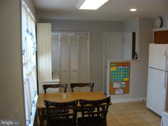 12818 Crisfield Road Silver Spring, MD 20906 - Photo 15 of 21 a view of a dining room with furniture and a window