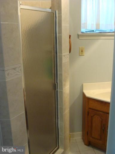 12818 Crisfield Road Silver Spring, MD 20906 - Photo 4 of 21 a bathroom with a sink and a mirror