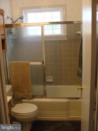 12818 Crisfield Road Silver Spring, MD 20906 - Photo 5 of 21 a bathroom with a sink and a toilet