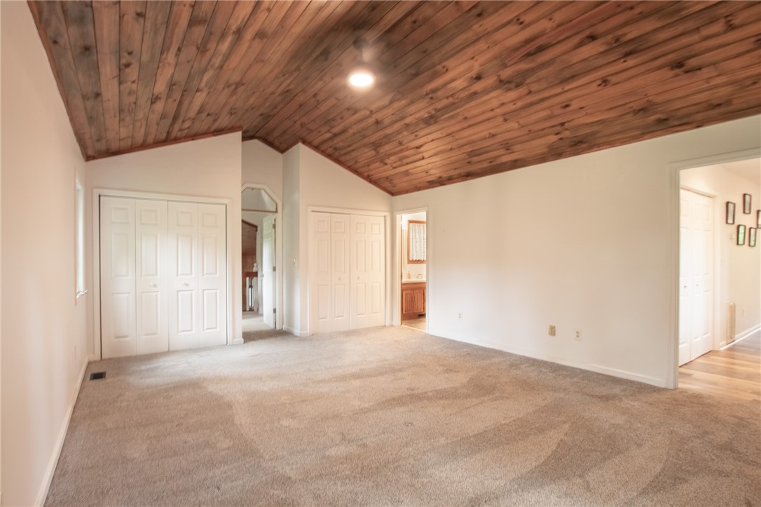 200 Chenault Road Townville, SC 29689 - Photo 22 of 47 Wood planked vaulted ceilings crown this spacious bedroom with ample closet storage.