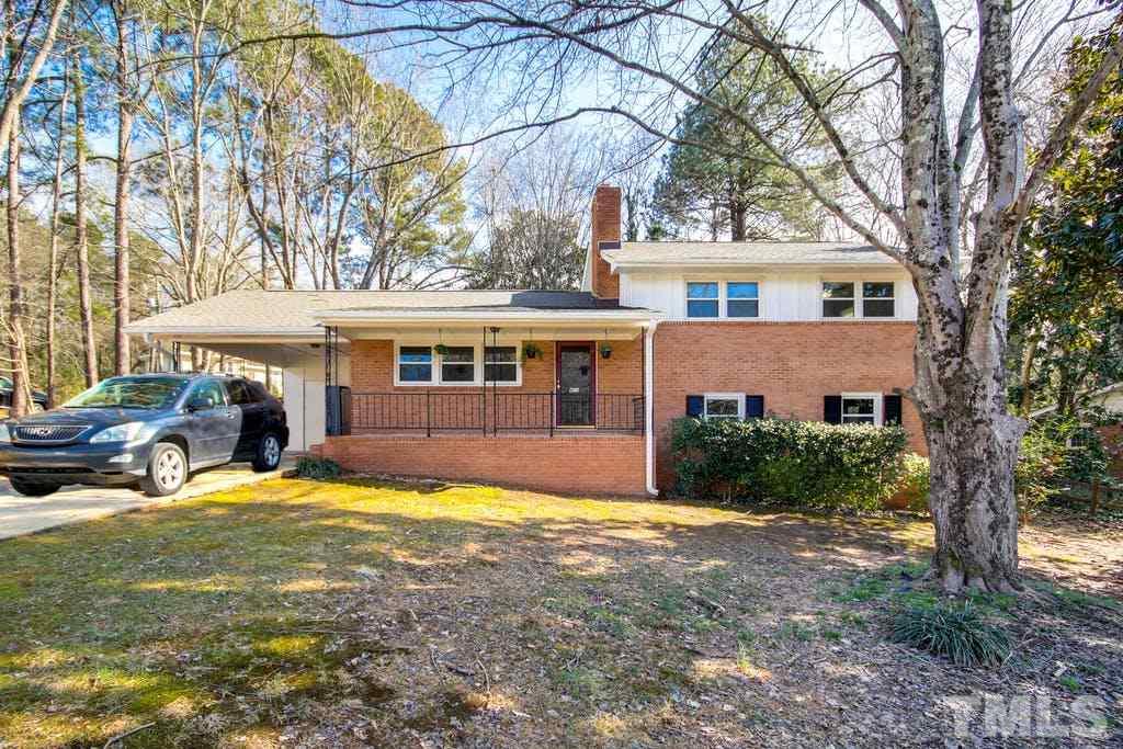 401 Buck Jones Road Raleigh, NC 27606 - Photo 2 of 21 a view of a house with swimming pool next to a yard