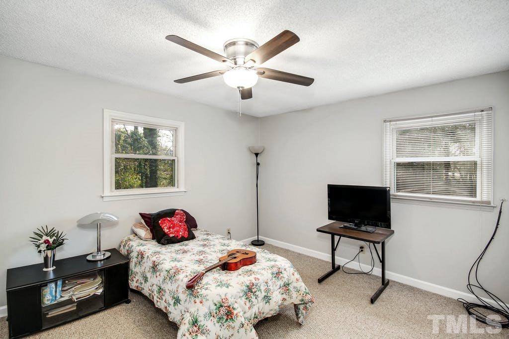 401 Buck Jones Road Raleigh, NC 27606 - Photo 14 of 21 a bedroom with bed and a window