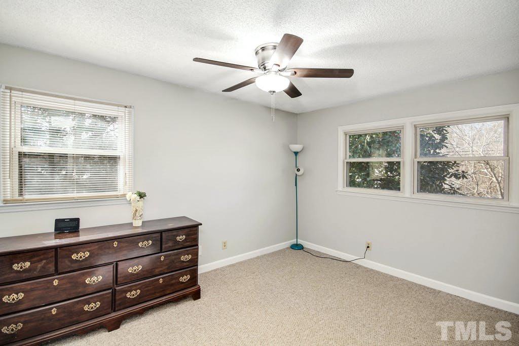 401 Buck Jones Road Raleigh, NC 27606 - Photo 15 of 21 a room with a dresser and a window