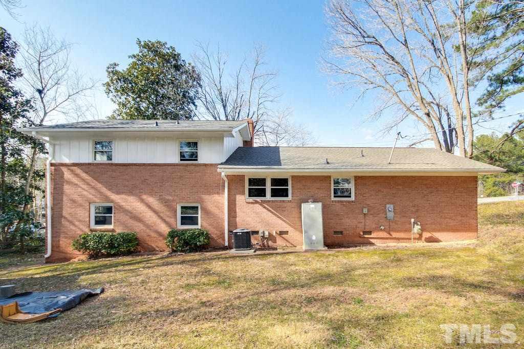 401 Buck Jones Road Raleigh, NC 27606 - Photo 20 of 21 front view of a house with a yard