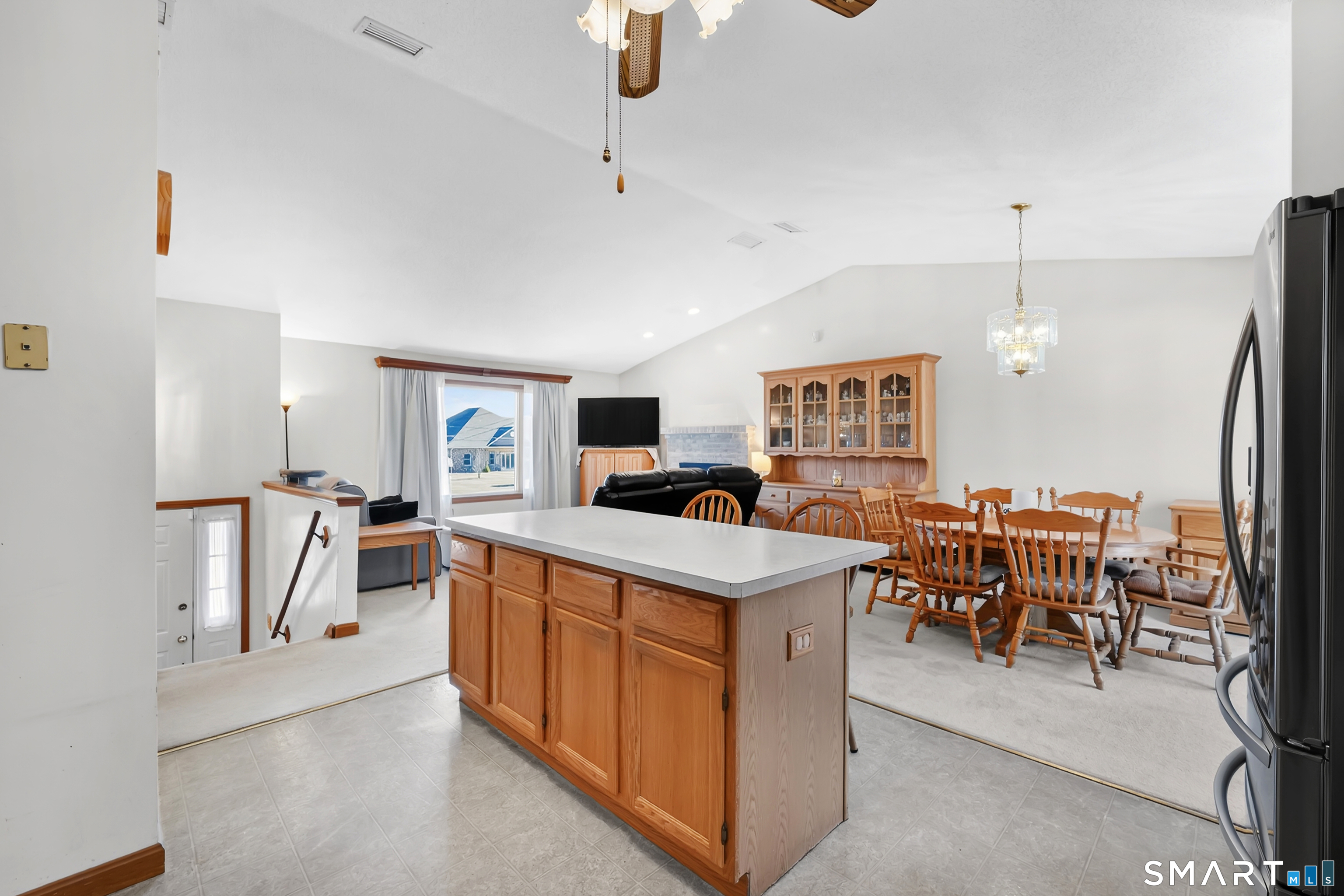 357 North Maple Street Enfield, CT 06082 - Photo 11 of 37 a living room with furniture a dining table and chairs