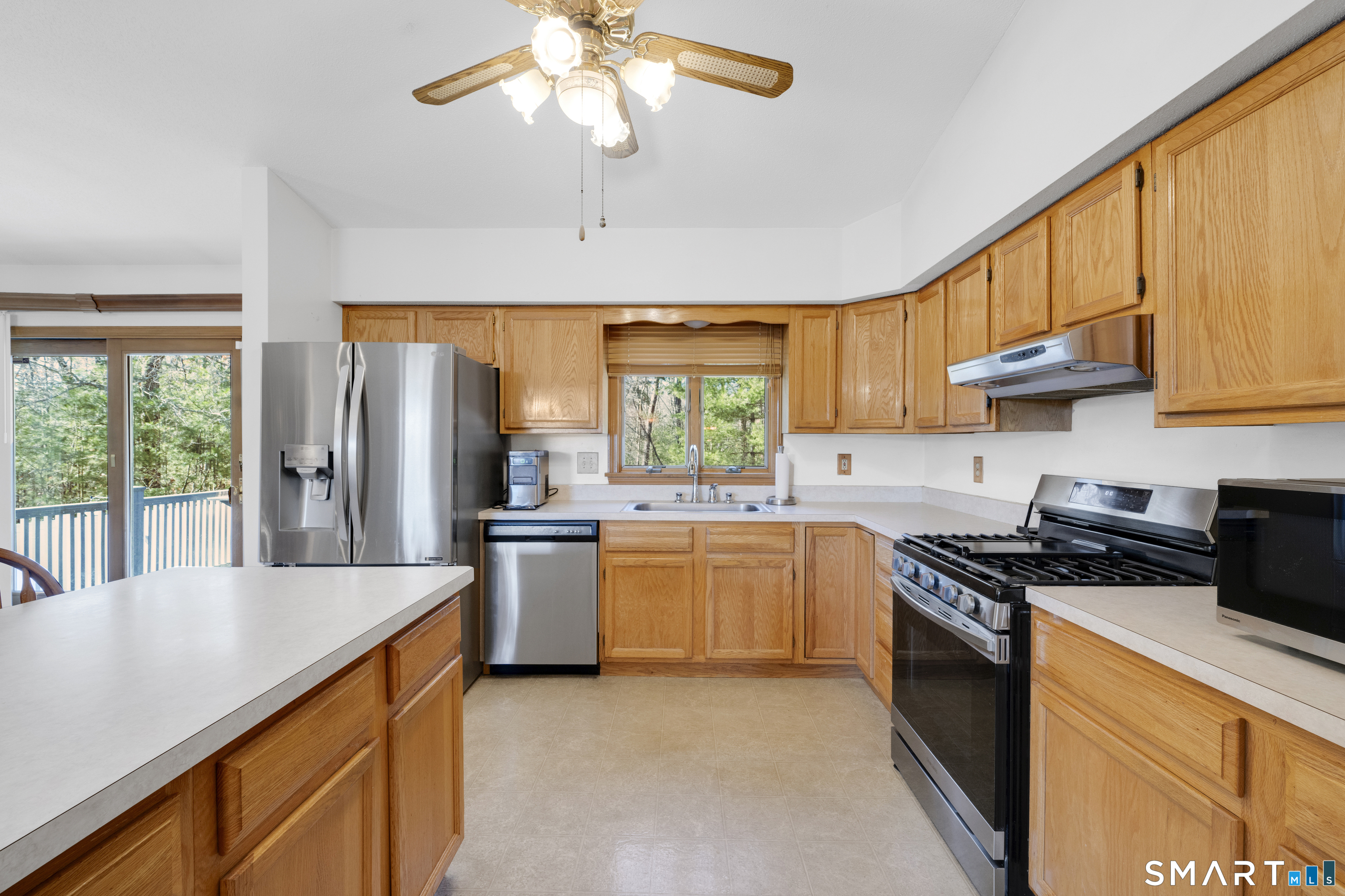357 North Maple Street Enfield, CT 06082 - Photo 14 of 37 a kitchen with stainless steel appliances granite countertop a stove a sink dishwasher and a refrigerator