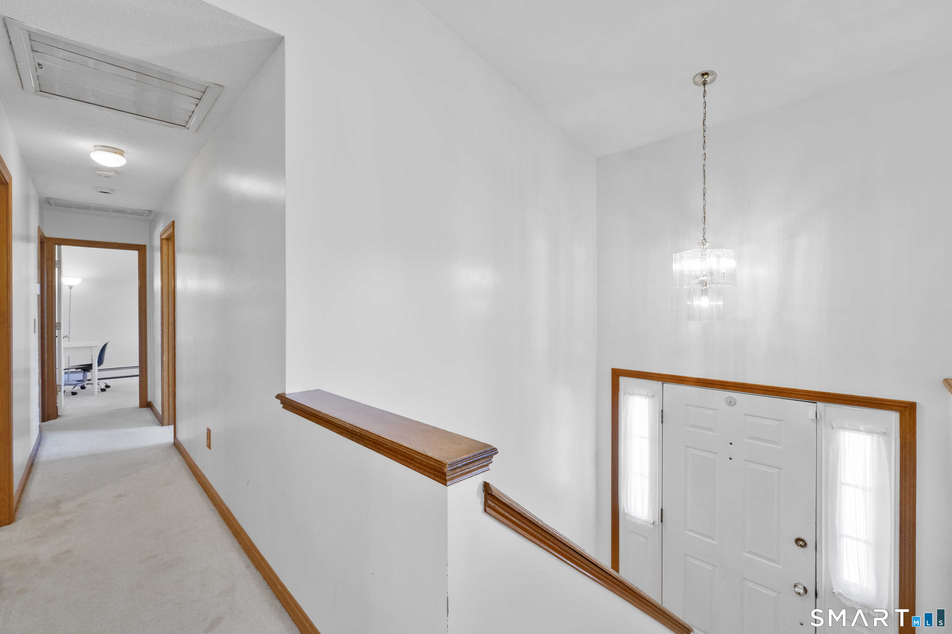 357 North Maple Street Enfield, CT 06082 - Photo 16 of 37 a view of a hallway with closet and wooden floor