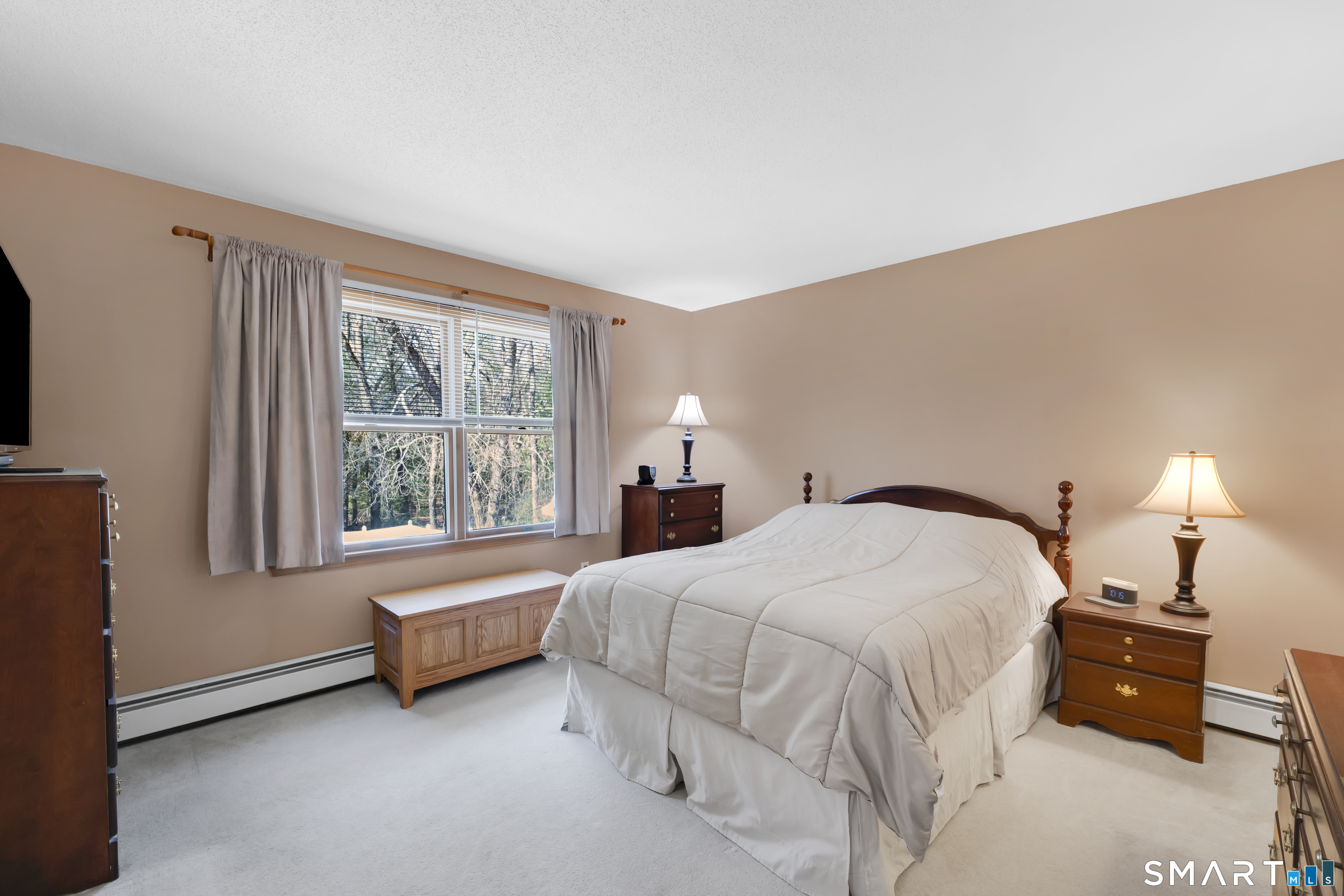 357 North Maple Street Enfield, CT 06082 - Photo 18 of 37 a bedroom with a bed and a window