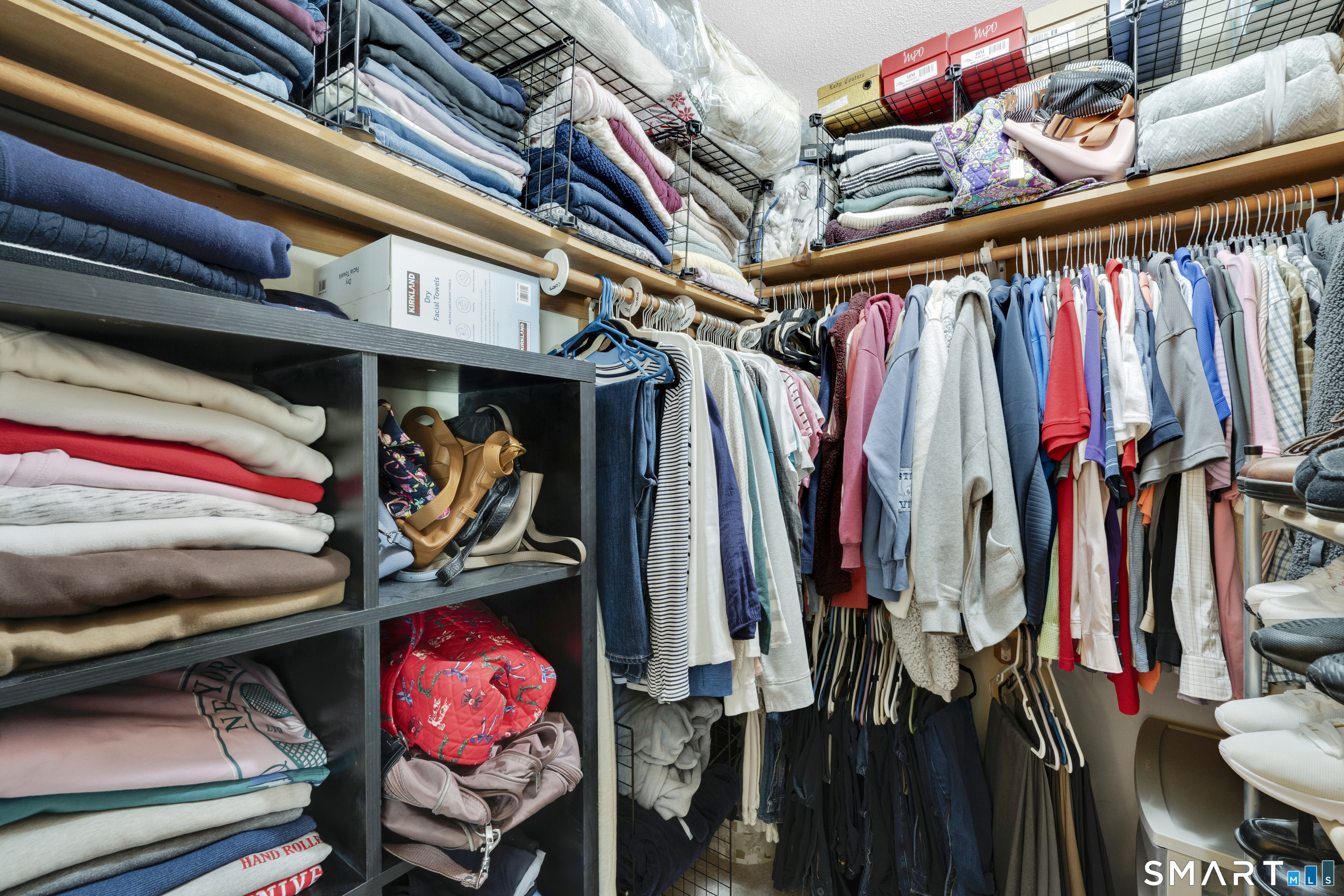 357 North Maple Street Enfield, CT 06082 - Photo 20 of 37 a view of walk in closet with clothes and shoes