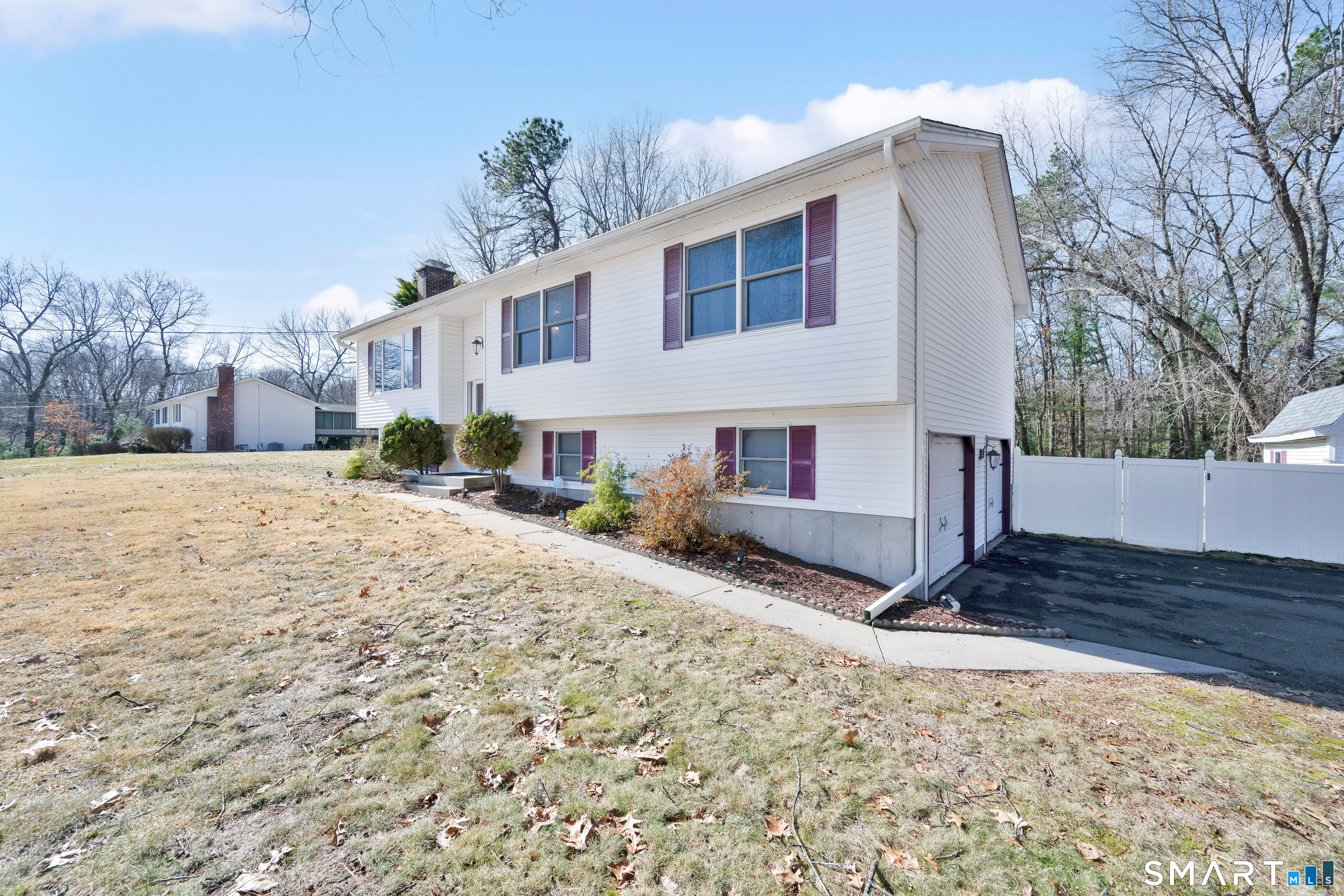 357 North Maple Street Enfield, CT 06082 - Photo 2 of 37 a view of a house with a snow in the yard