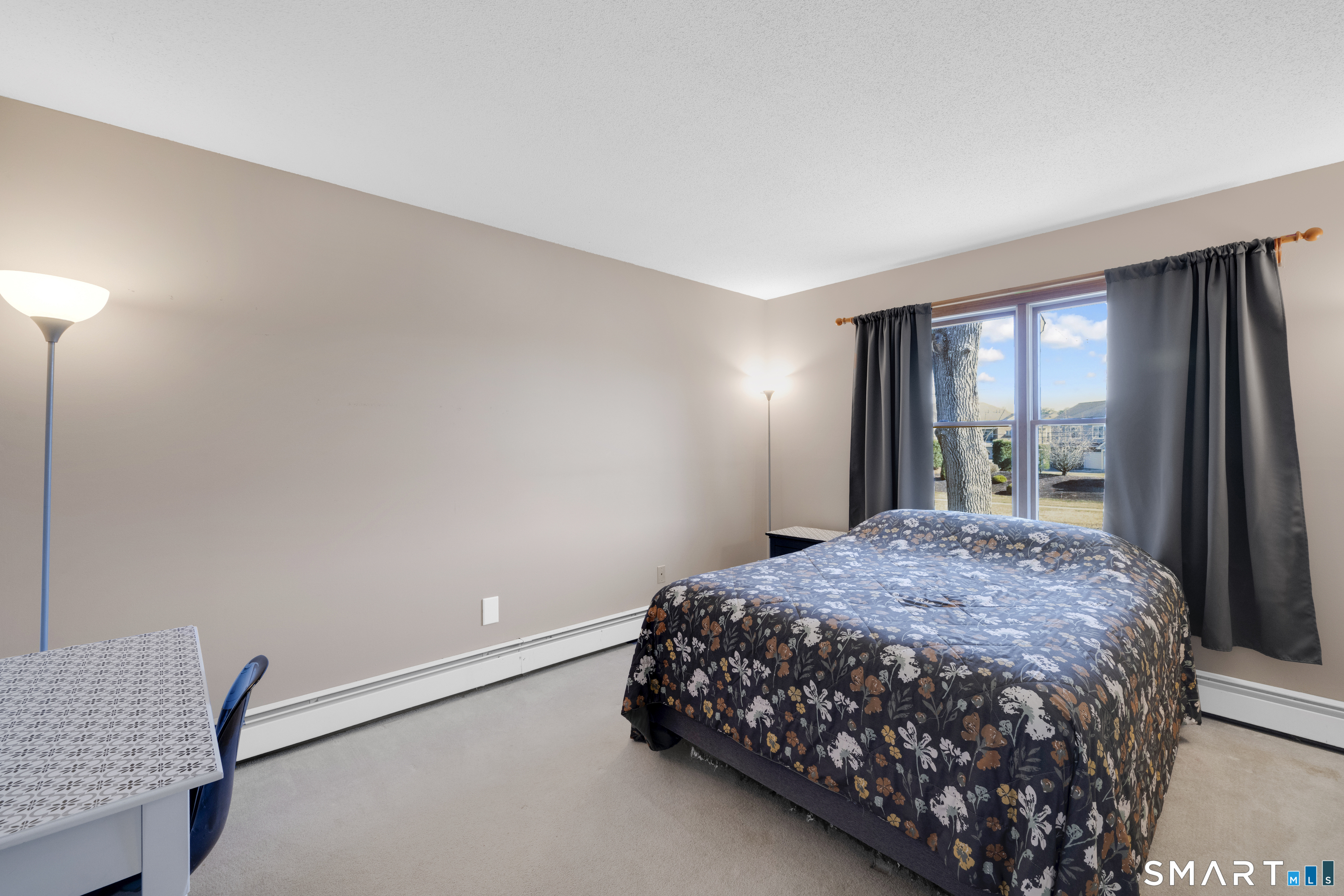 357 North Maple Street Enfield, CT 06082 - Photo 22 of 37 a bedroom with a bed and a window