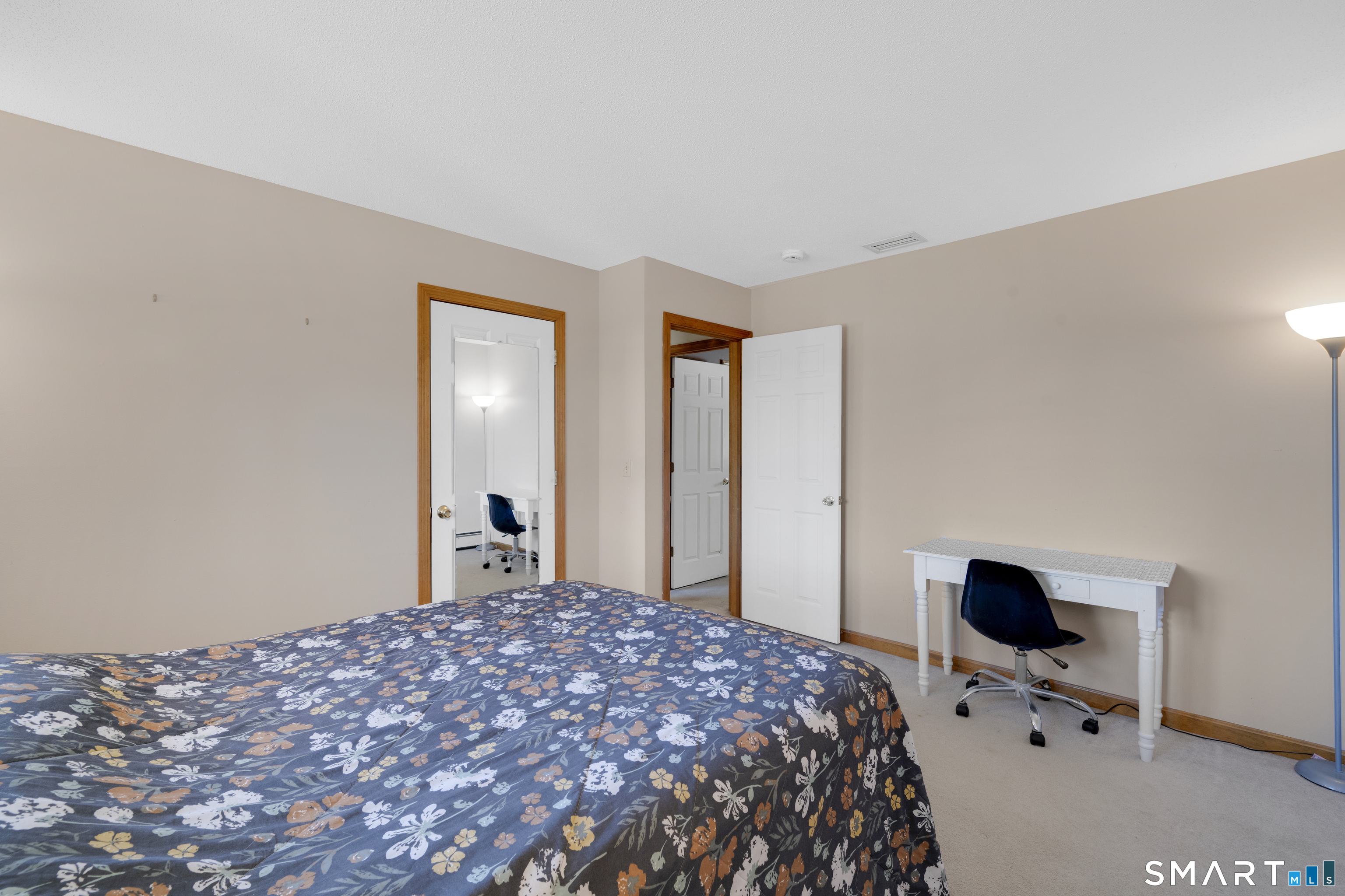 357 North Maple Street Enfield, CT 06082 - Photo 23 of 37 a bedroom with a bed and wooden floor