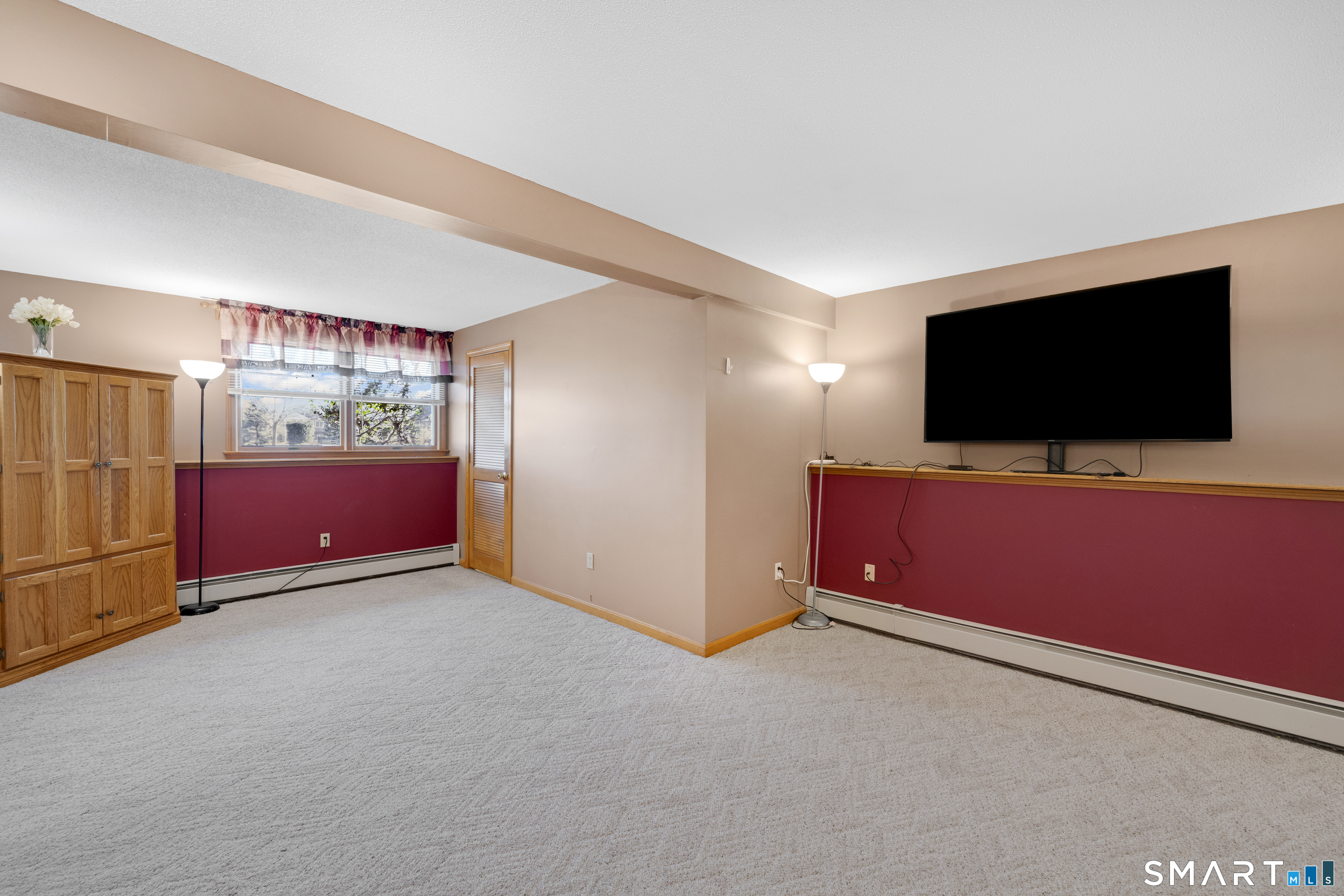 357 North Maple Street Enfield, CT 06082 - Photo 28 of 37 a view of workspace with furniture and flat screen tv