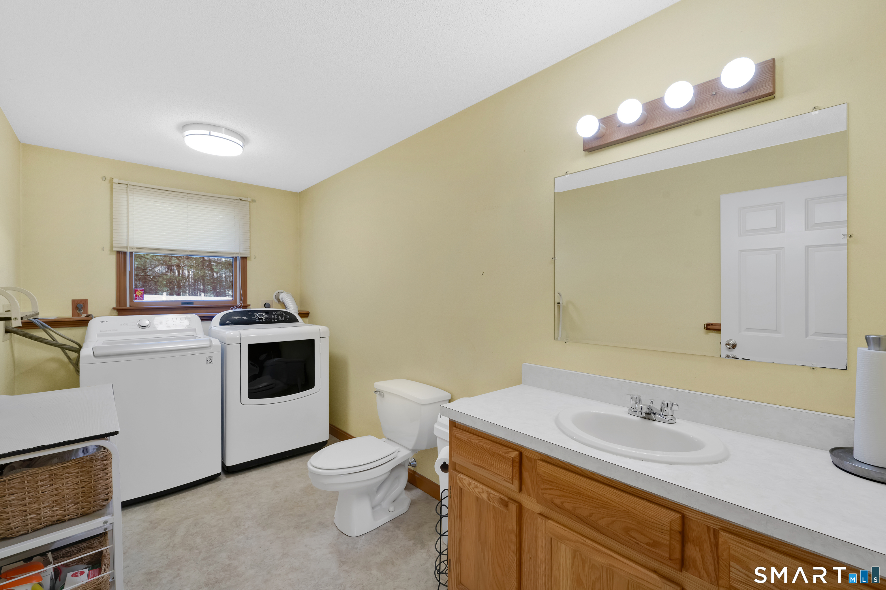 357 North Maple Street Enfield, CT 06082 - Photo 30 of 37 a bathroom with a toilet sink and mirror