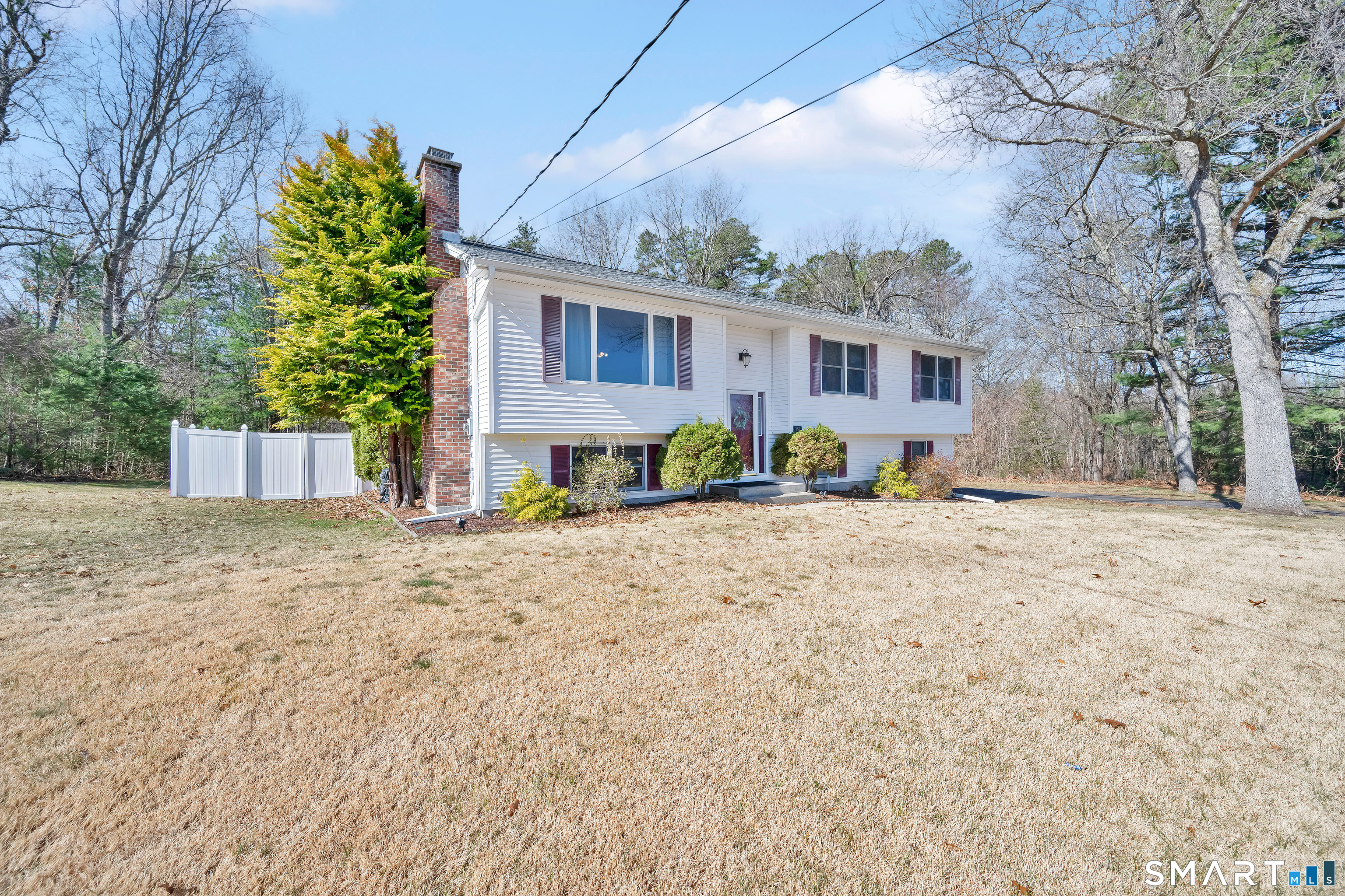 357 North Maple Street Enfield, CT 06082 - Photo 3 of 37 a view of a house with a yard covered in snow