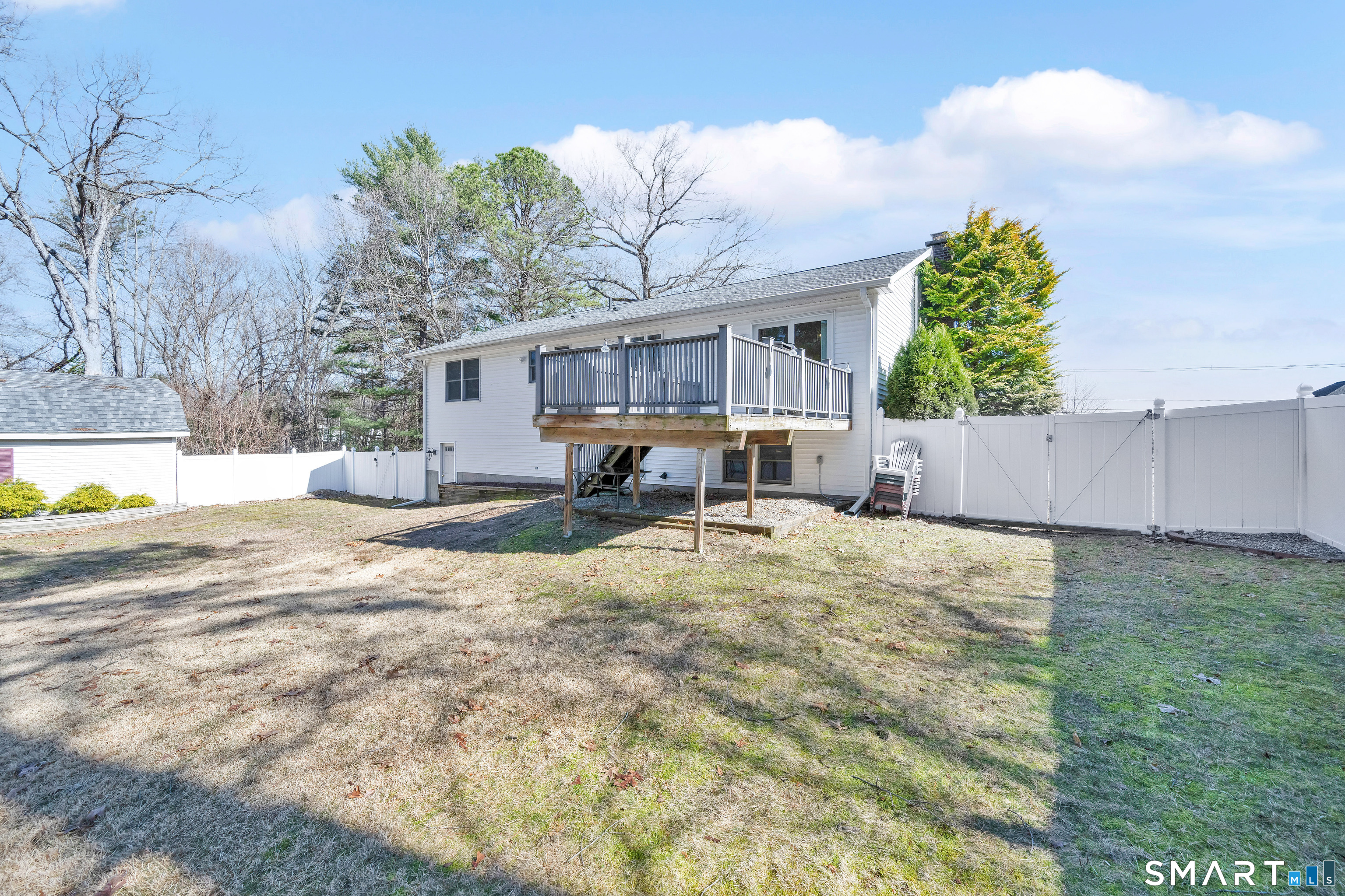 357 North Maple Street Enfield, CT 06082 - Photo 35 of 37 a backyard of a house with table and chairs
