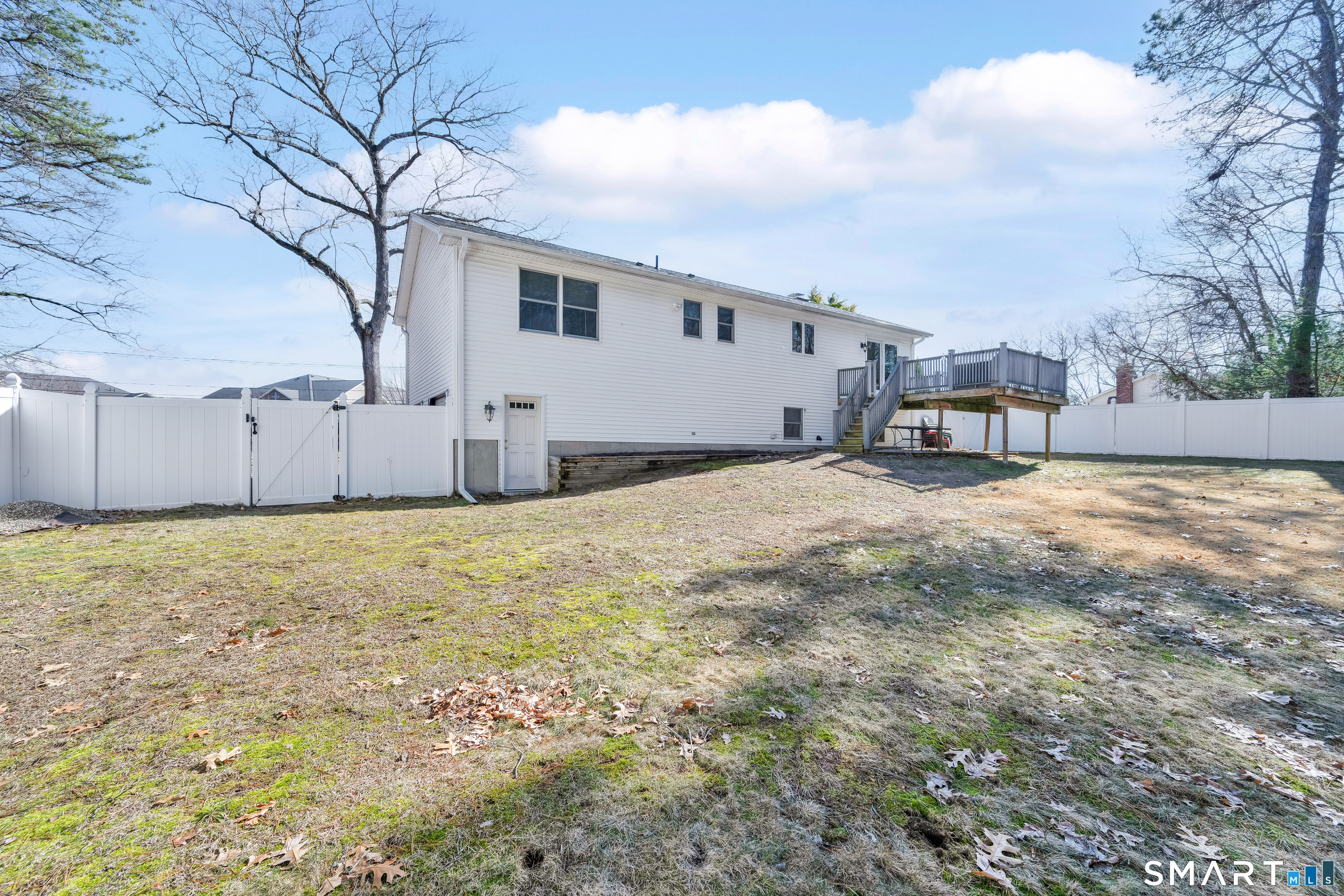 357 North Maple Street Enfield, CT 06082 - Photo 36 of 37 a view of a house with a big yard and large tree