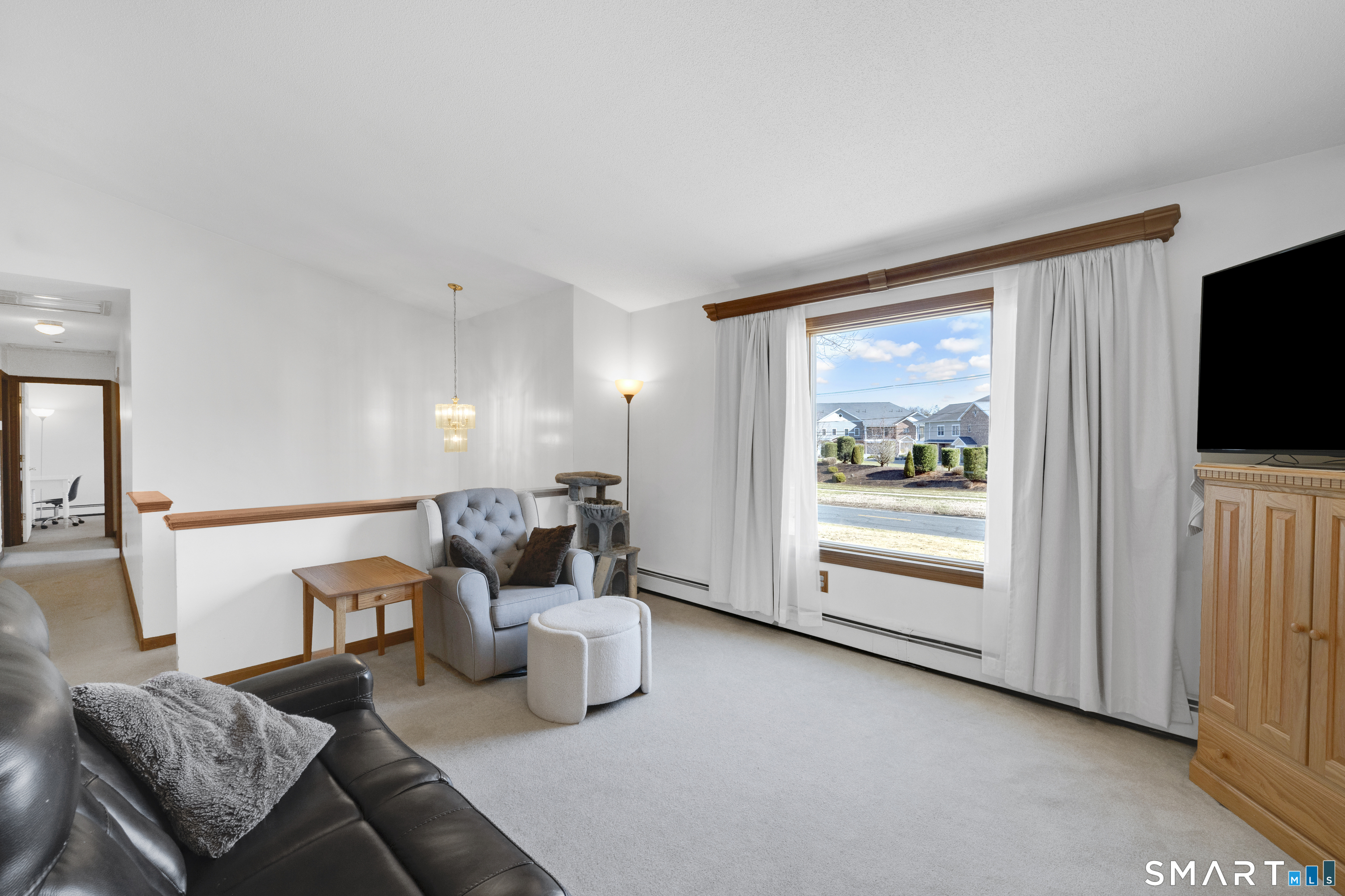 357 North Maple Street Enfield, CT 06082 - Photo 4 of 37 a living room with furniture and a flat screen tv