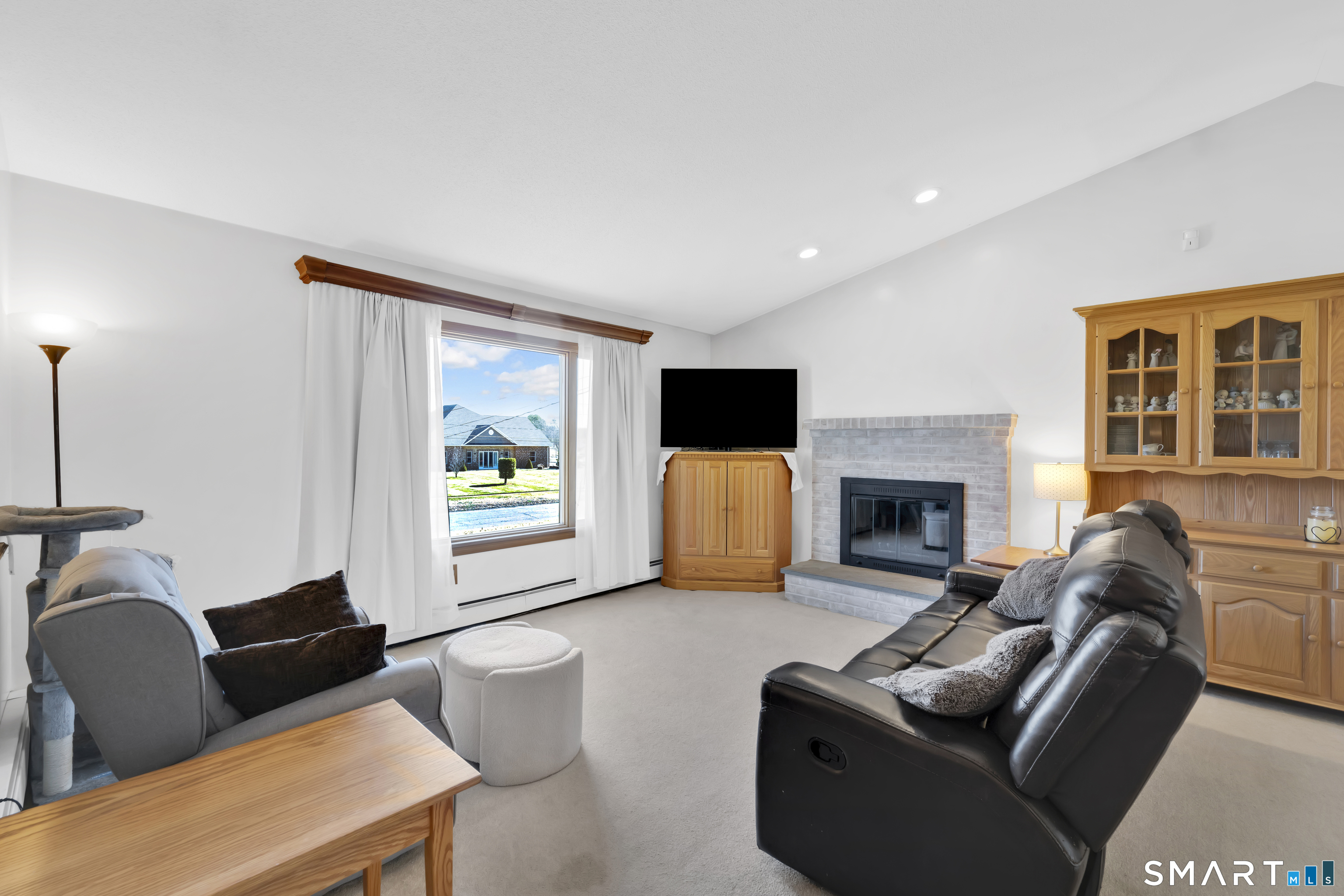 357 North Maple Street Enfield, CT 06082 - Photo 6 of 37 a living room with furniture and a fireplace