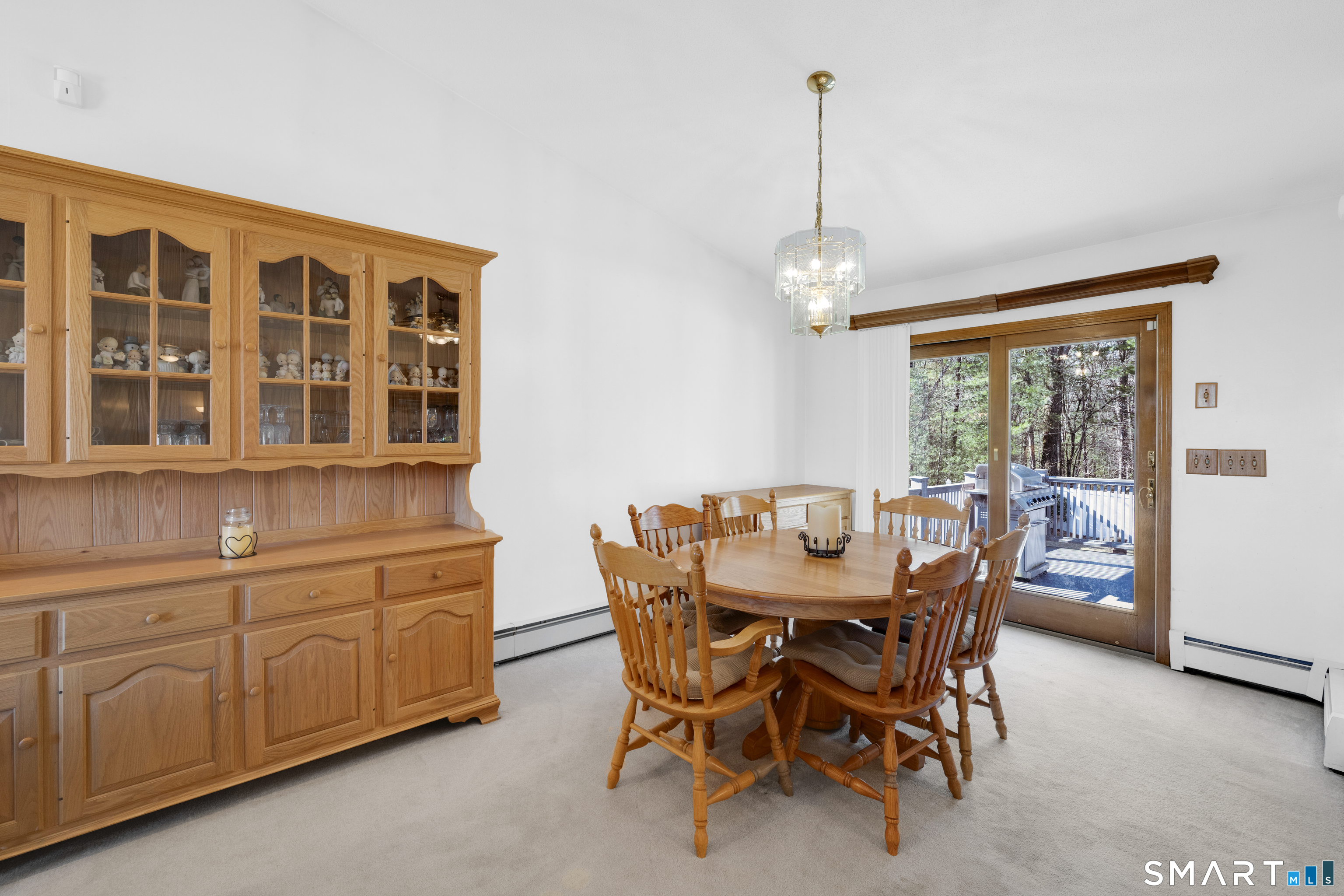 357 North Maple Street Enfield, CT 06082 - Photo 9 of 37 a dining room with furniture a chandelier and wooden floor