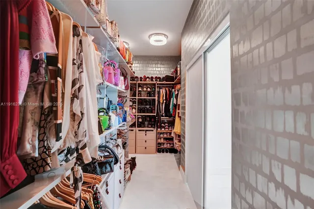 a view of a livingroom with furniture window and wooden floor