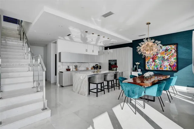 a view of a livingroom with furniture and a flat screen tv