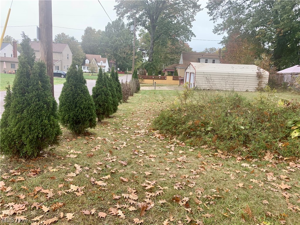 665 Dorchester Road Akron, OH 44320 - Photo 6 of 18 View of yard with an outdoor structure