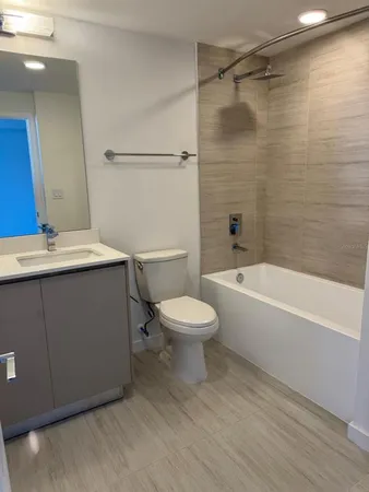 a bathroom with a sink a toilet and a bathtub