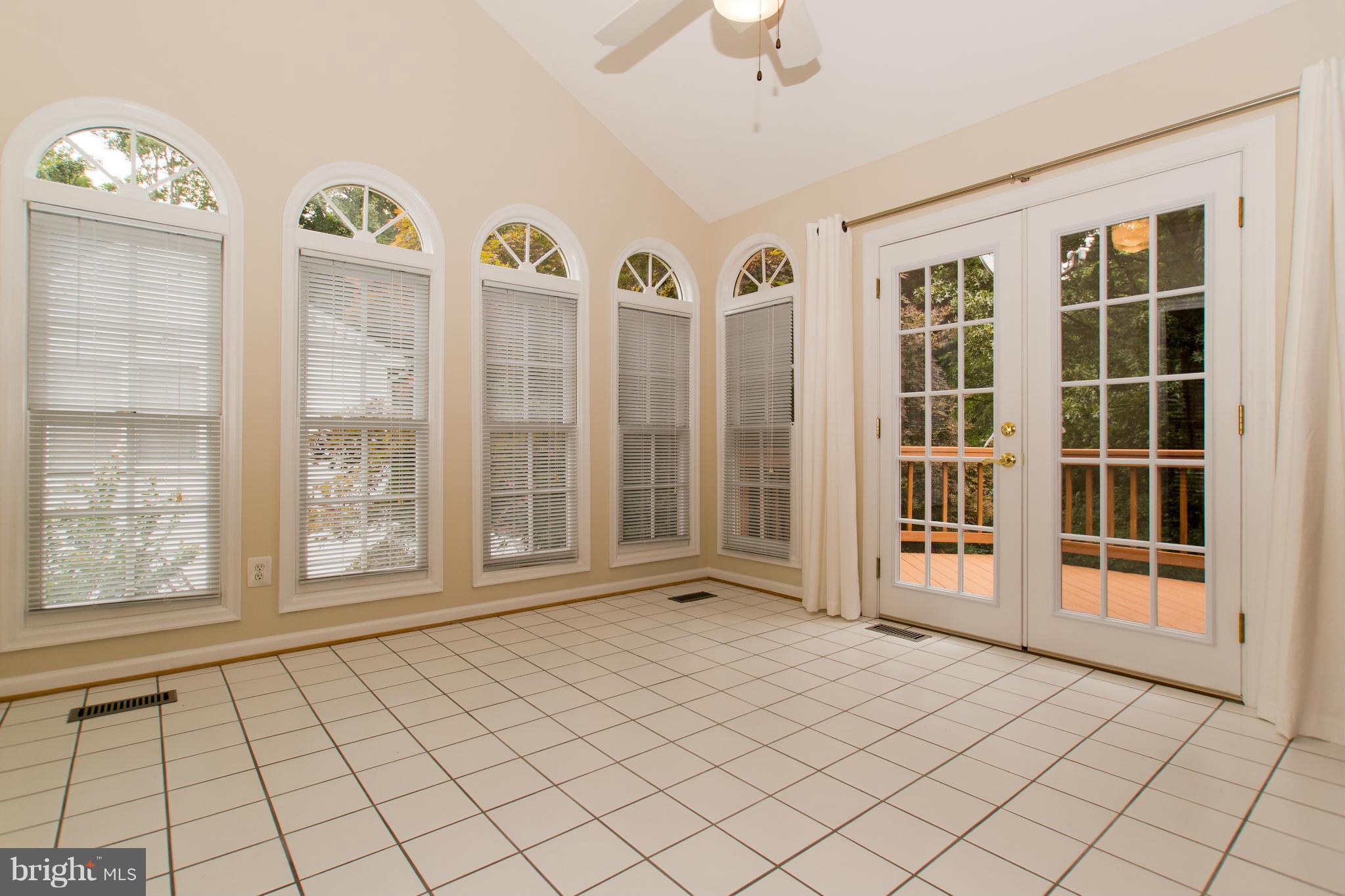 8334 Kings Ridge Court Springfield, VA 22153 - Photo 14 of 30 Sun Room/Cathedral Ceiling/Plant Shelf