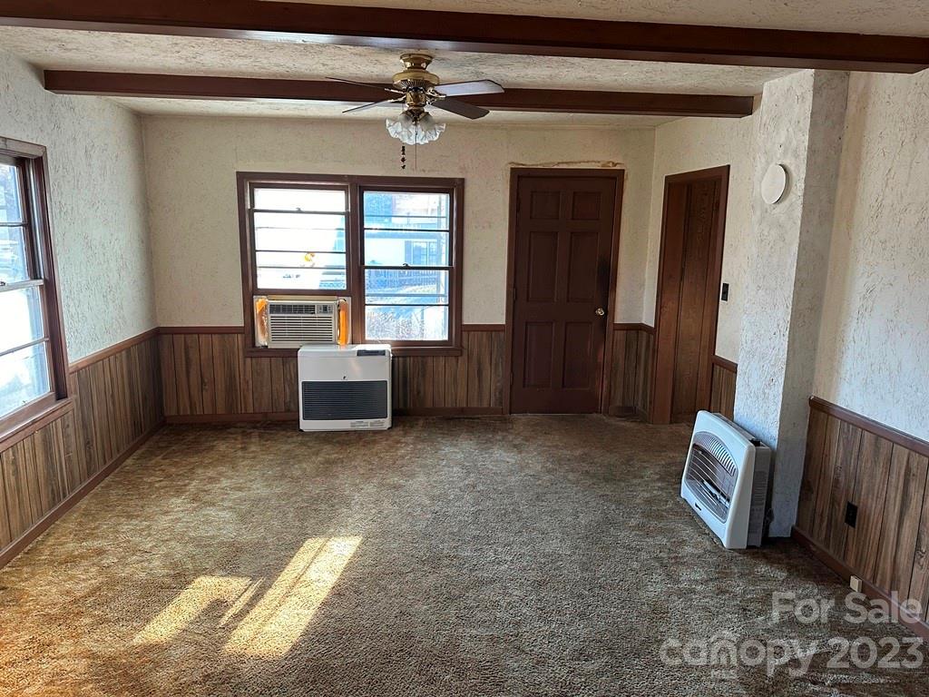 91 Beaver Street Tryon, NC 28782 - Photo 4 of 13 a living room with furniture and a window