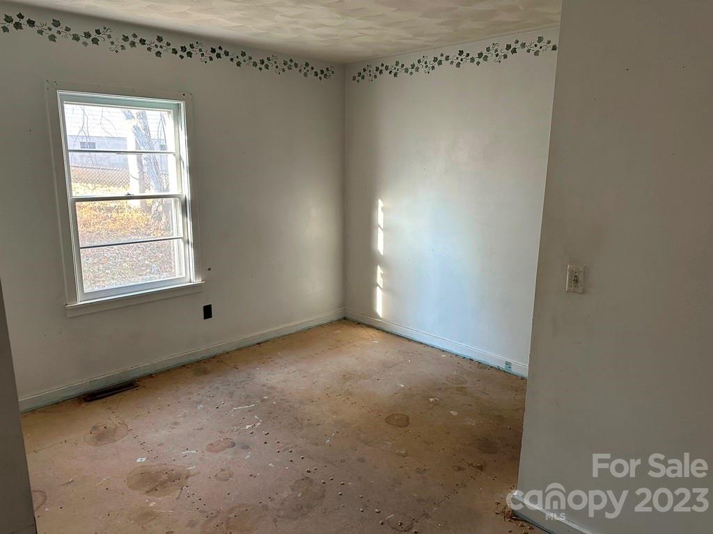 91 Beaver Street Tryon, NC 28782 - Photo 7 of 13 a view of an empty room with a window