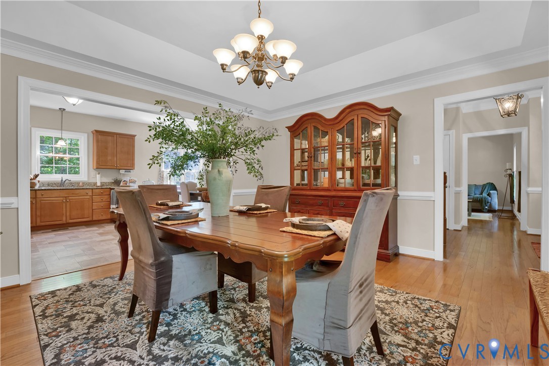 16148 Buckfast Place Beaverdam, VA 23015 - Photo 13 of 48 a view of a dining room with furniture and chandelier
