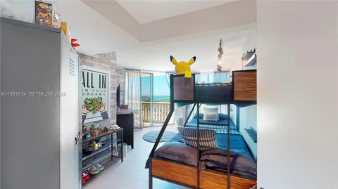 a bedroom with furniture and a window