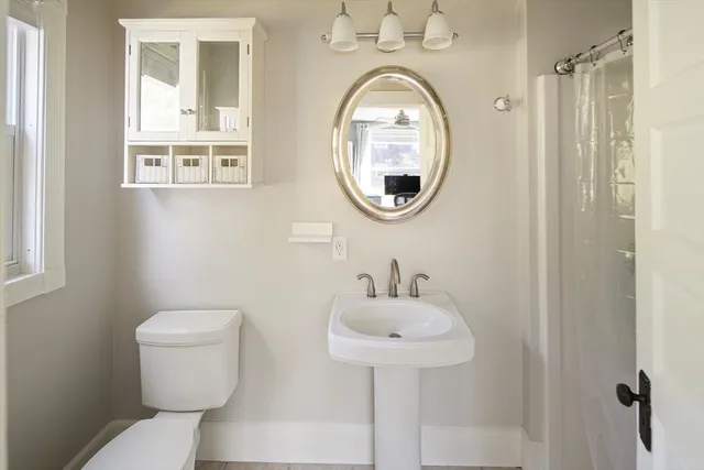 a bathroom with a toilet and a sink