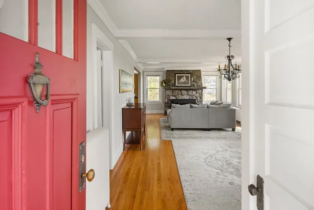 a bedroom with furniture and a wooden floor