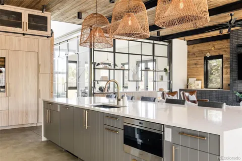 a kitchen with stainless steel appliances granite countertop a sink and a counter space