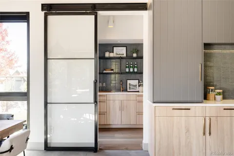 a kitchen with a refrigerator a washer and dryer