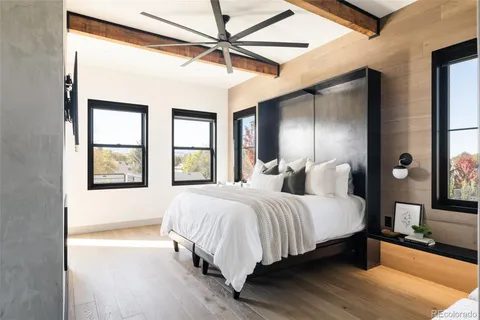 a bedroom with bed and window