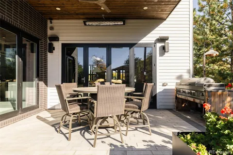 a view of a house with yard floor and a fireplace in front of it