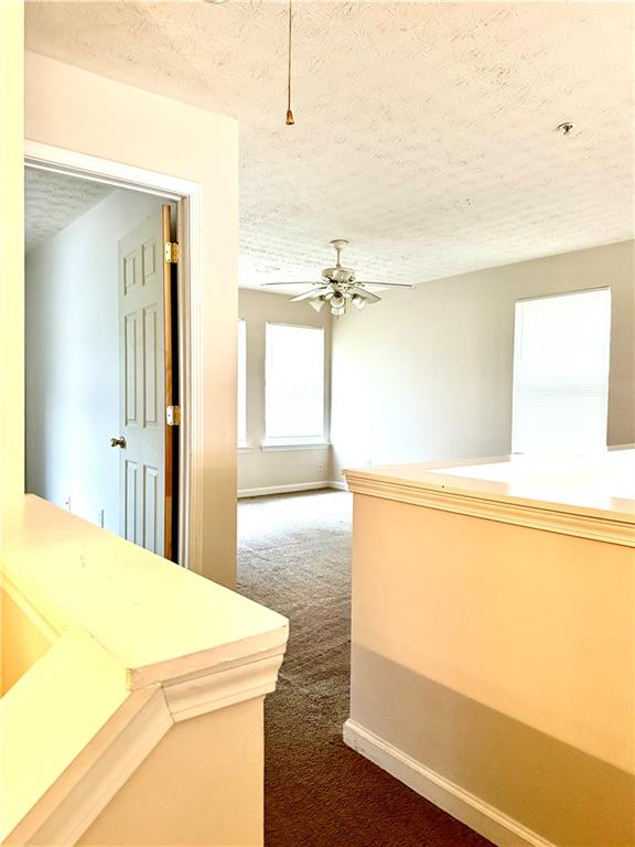 3162 Panthers Trace Decatur, GA 30034 - Photo 13 of 20 a room with a bed and a bookshelf