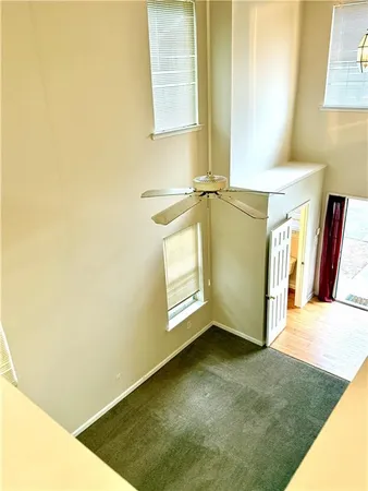 a white toilet sitting next to a bath tub and a shower