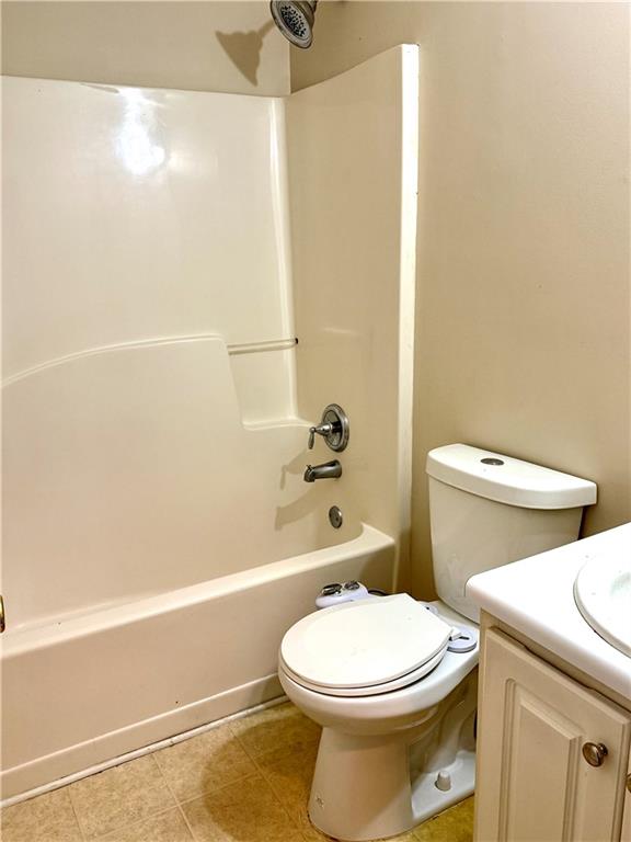 3162 Panthers Trace Decatur, GA 30034 - Photo 19 of 20 a white toilet sitting next to a bath tub and a shower