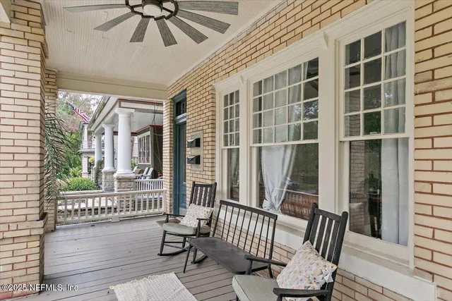 a view of a balcony with furniture