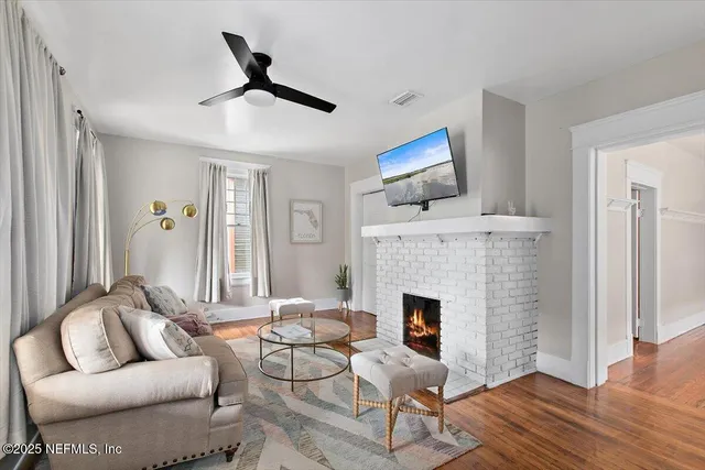 a living room with furniture and a fireplace