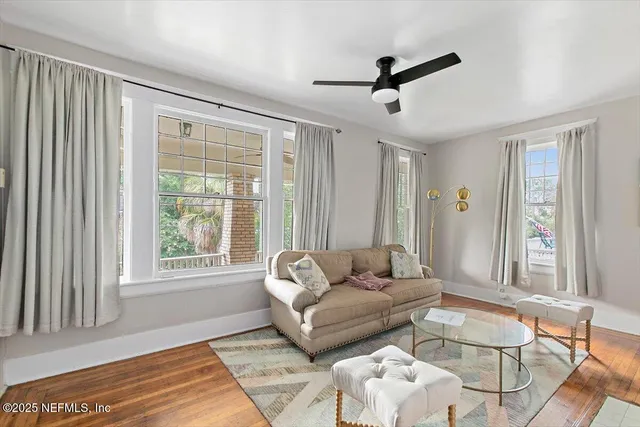 a living room with furniture and a window