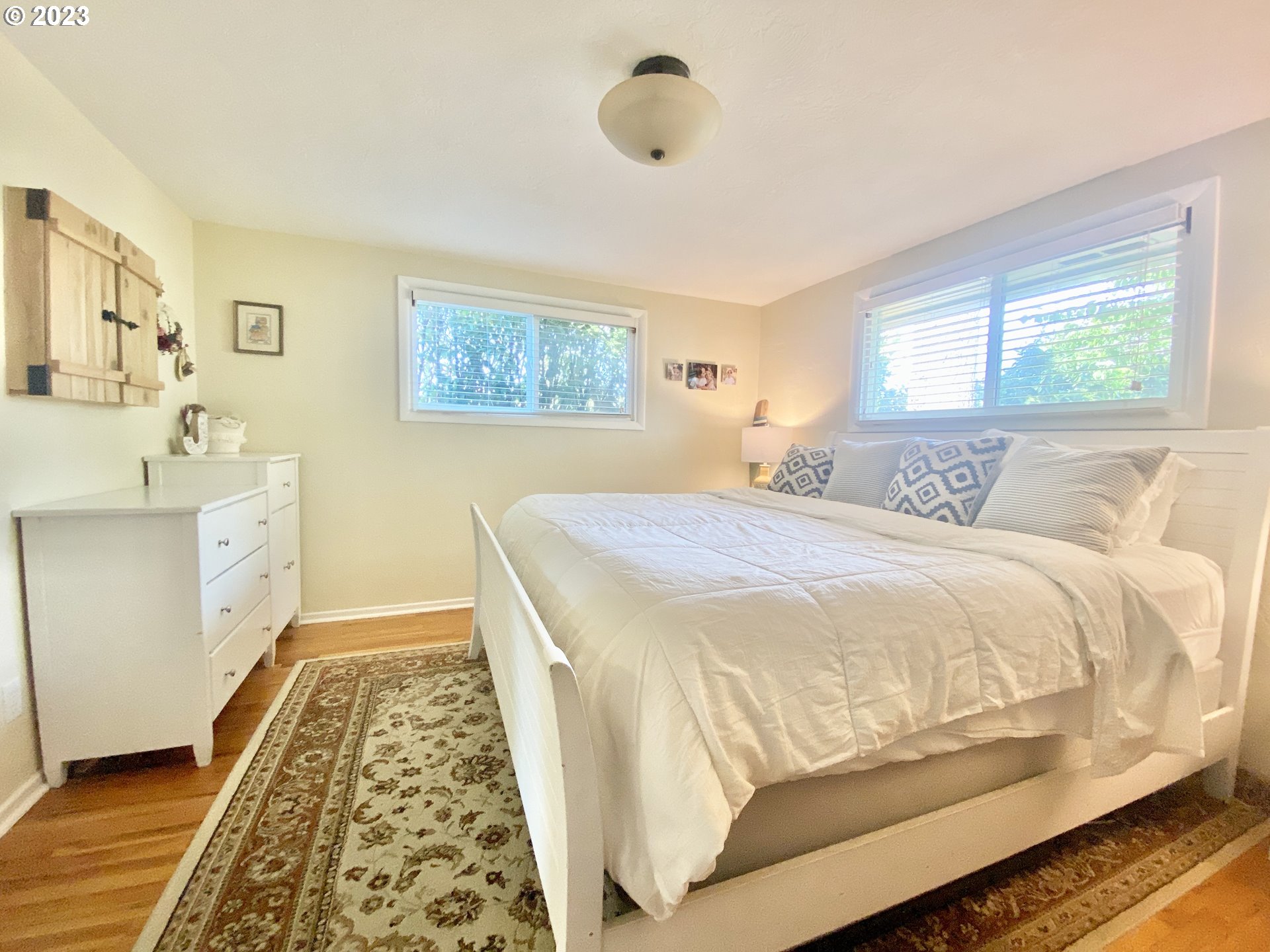 2181 5th Street Springfield, OR 97477 - Photo 9 of 39 a bedroom with a bed and wooden floor