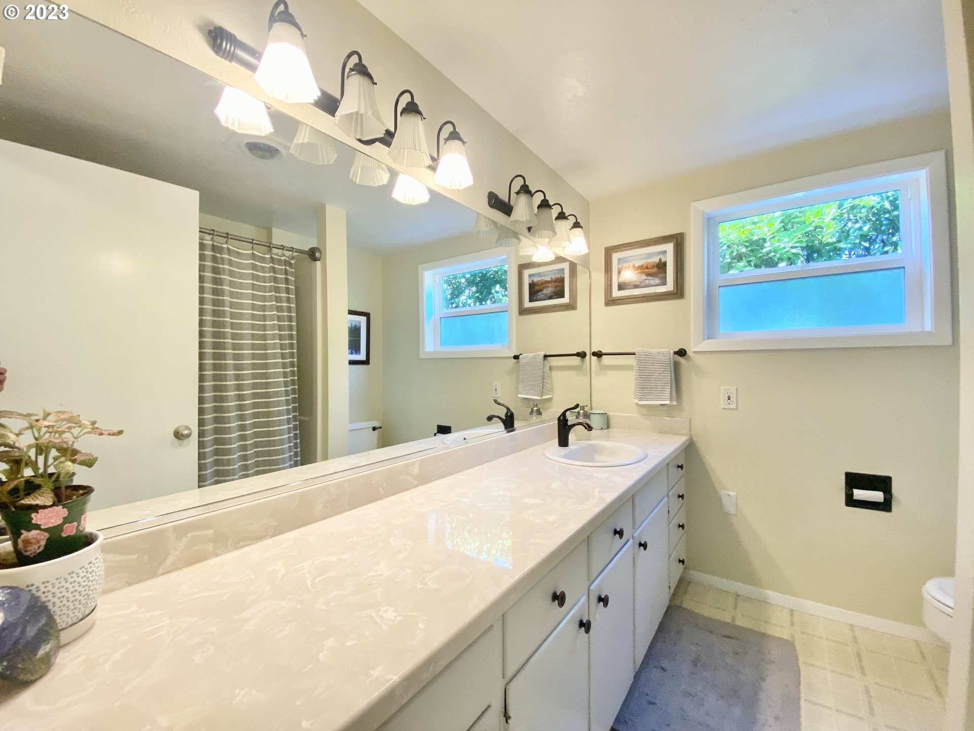 2181 5th Street Springfield, OR 97477 - Photo 10 of 39 a spacious bathroom with a double vanity sink mirror and toilet