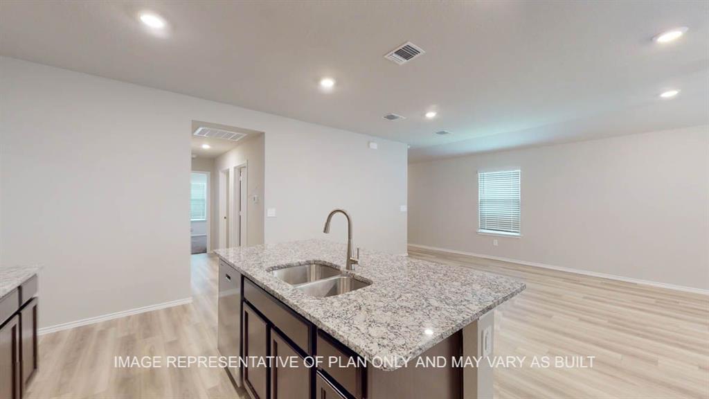 3201 Cyprian Road Lorena, TX 76655 - Photo 6 of 27 a kitchen with a sink a counter space and a dining table